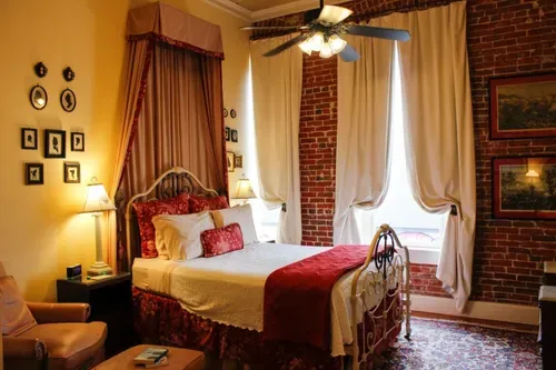 Guest room with a bed and ceiling fan