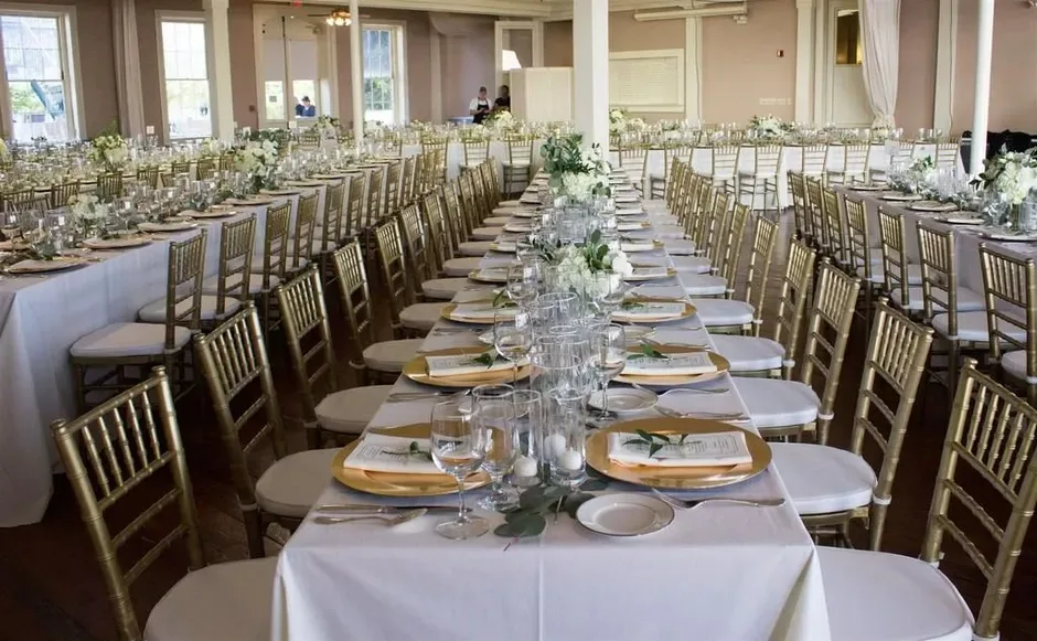 Event room arranged with tables and buffet