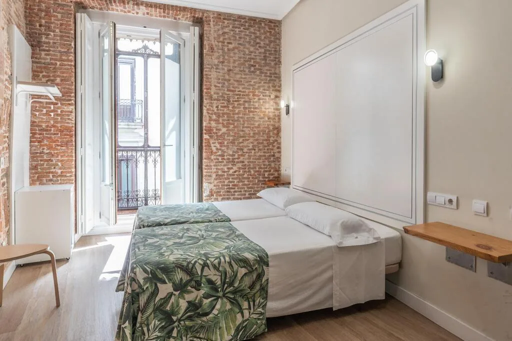 Habitación exterior con dos camas individuales