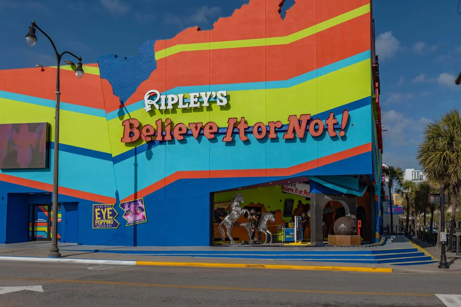 A brightly painted Ripley’s Believe It or Not! building stands beside a city street.