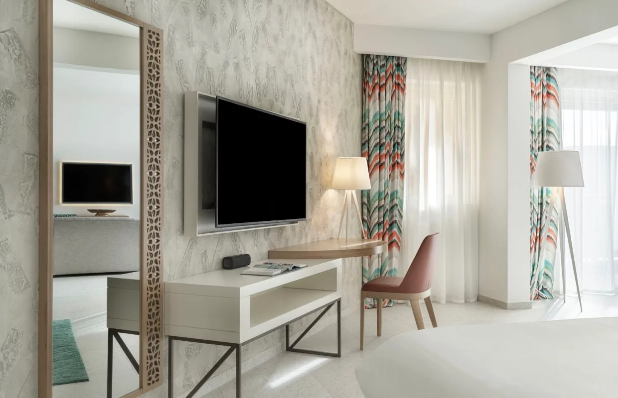 Room with desk and television