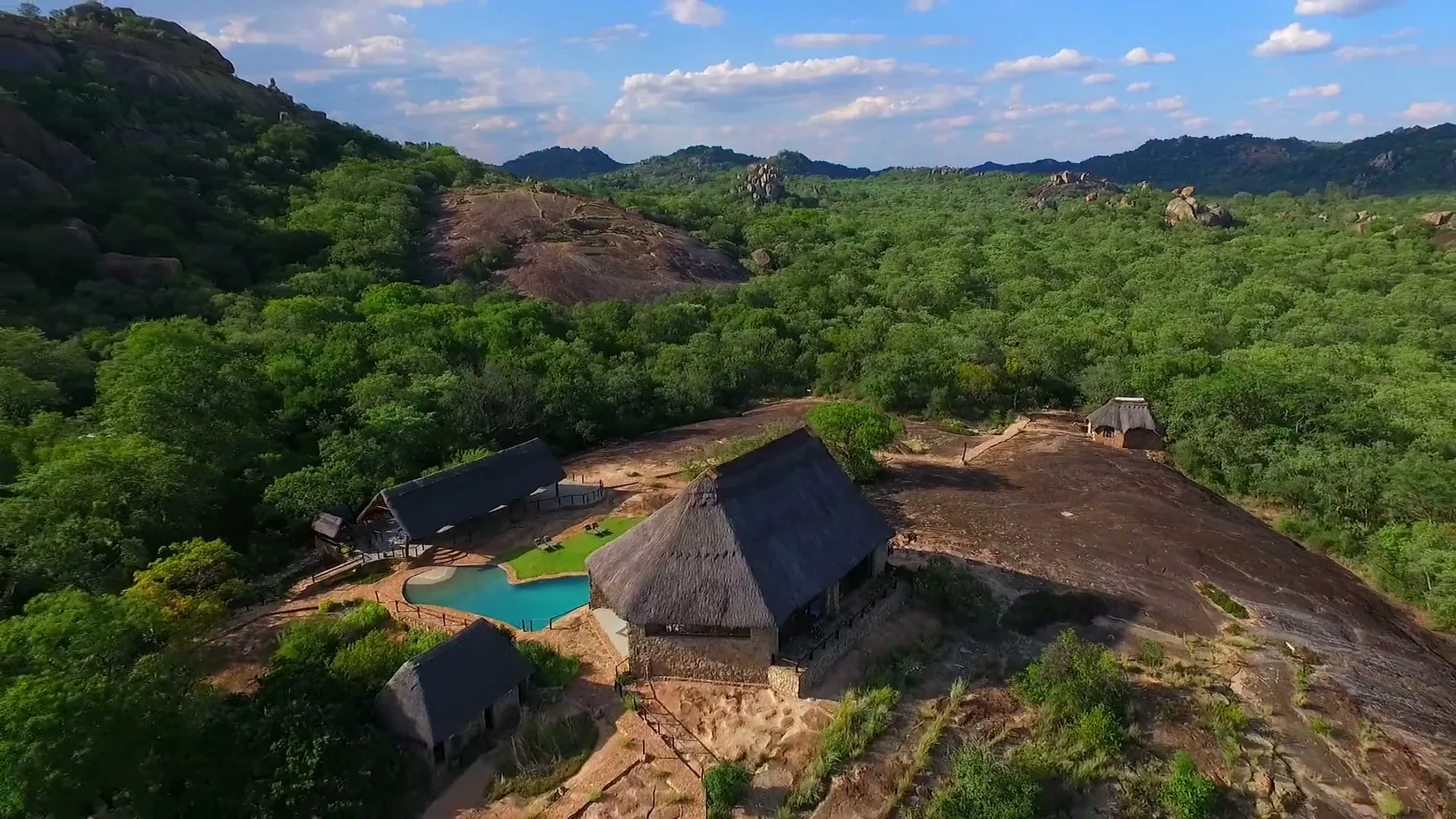 Aerial view of Matobo Hills Lodge and its pool among granite kopjes