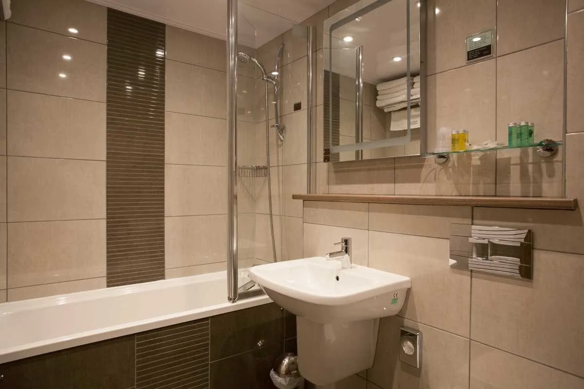 Hotel bathroom with bath
