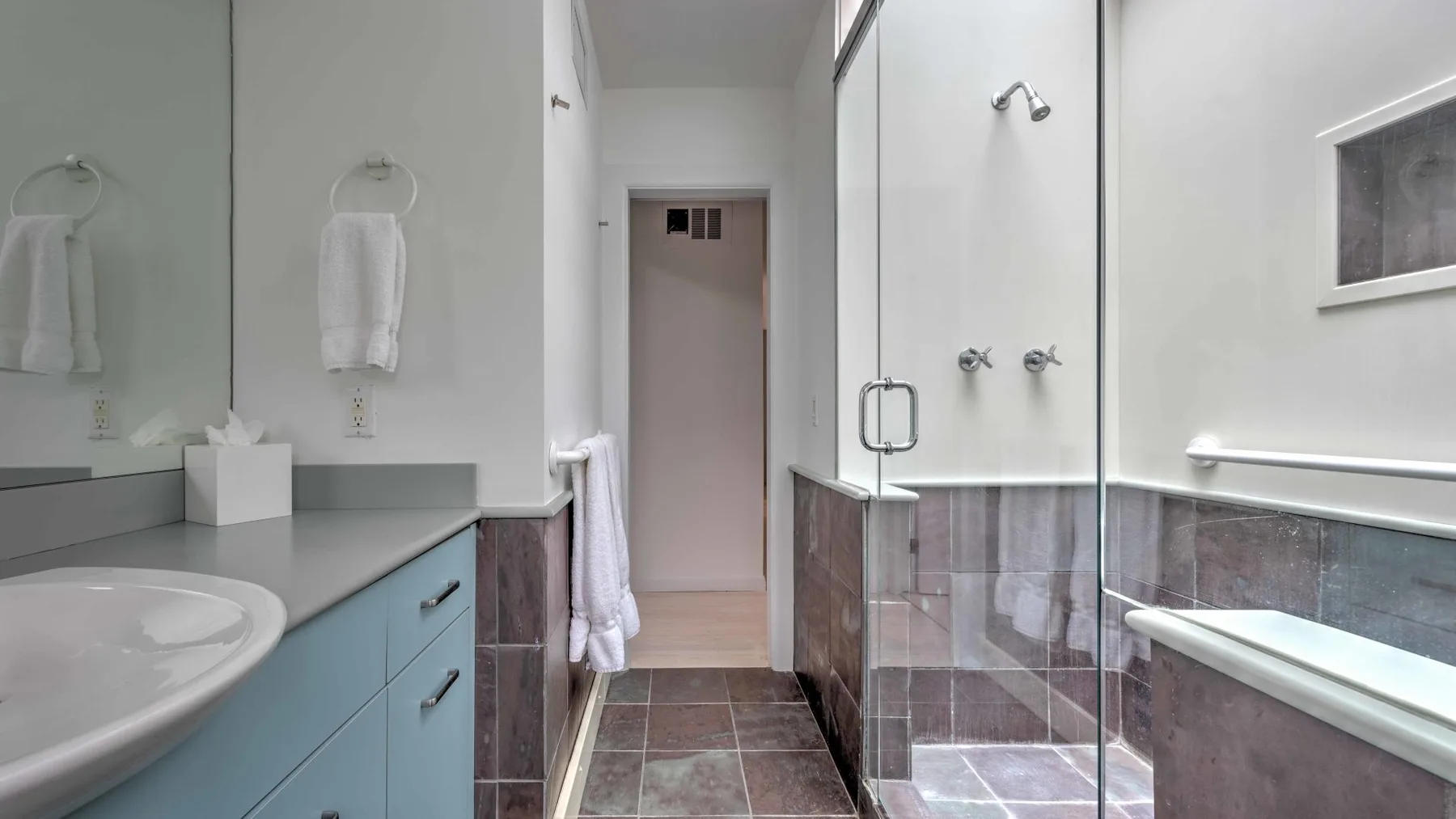 A bathroom with a sink, shower, and bathtub.