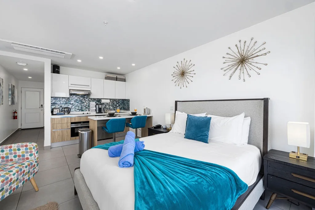 Unwind in your chic open-plan studio, where plush bedding and stylish accents meet a fully equipped kitchenette, giving you comfort and convenience in one inviting space.