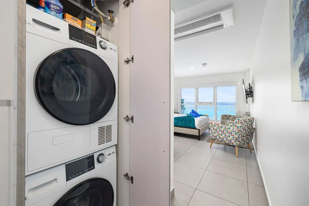 You'll love having in-unit laundry tucked away in a convenient closet—no need to venture out when you can quickly freshen up your clothes steps from your sea-view bedroom.