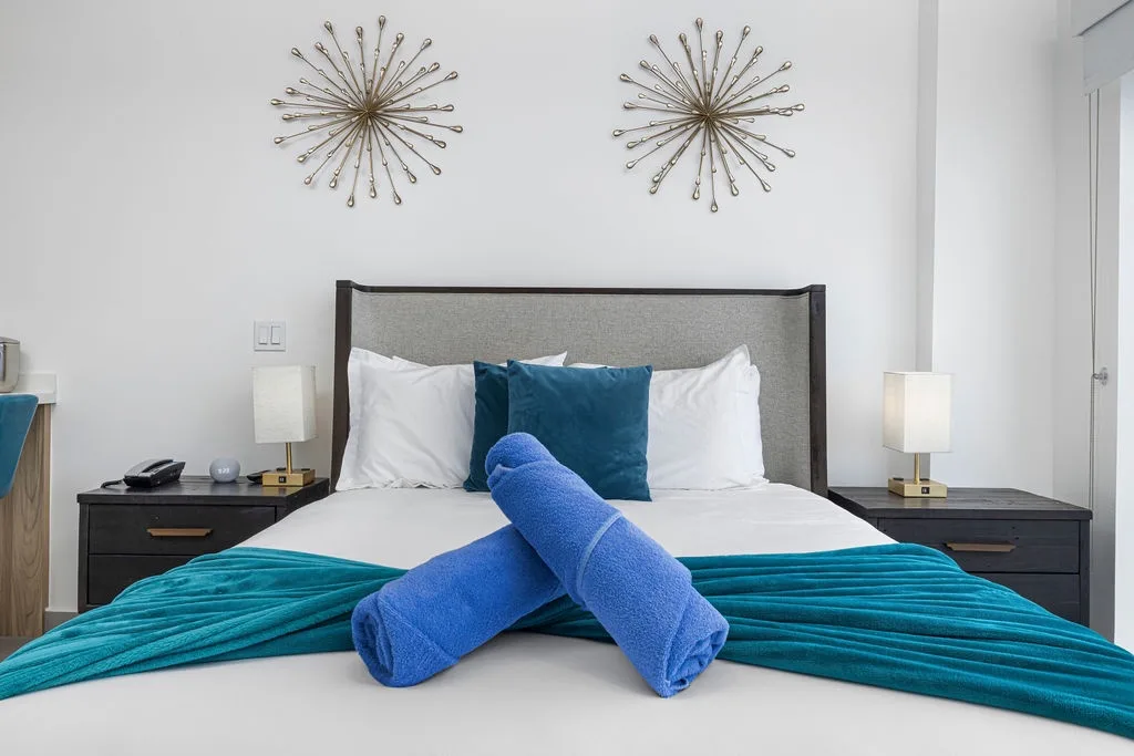 Sink into crisp linens and plush pillows in your peaceful bedroom retreat, where modern style meets ultimate comfort after a day of adventure.
