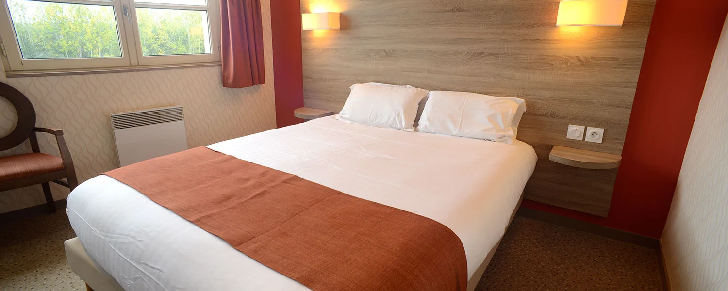 Guest room with a large double bed