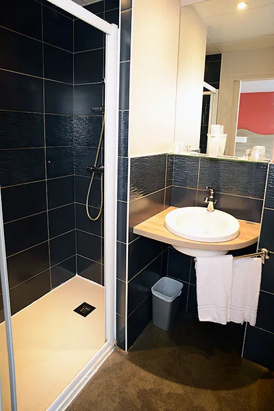 Private bathroom with shower and sink