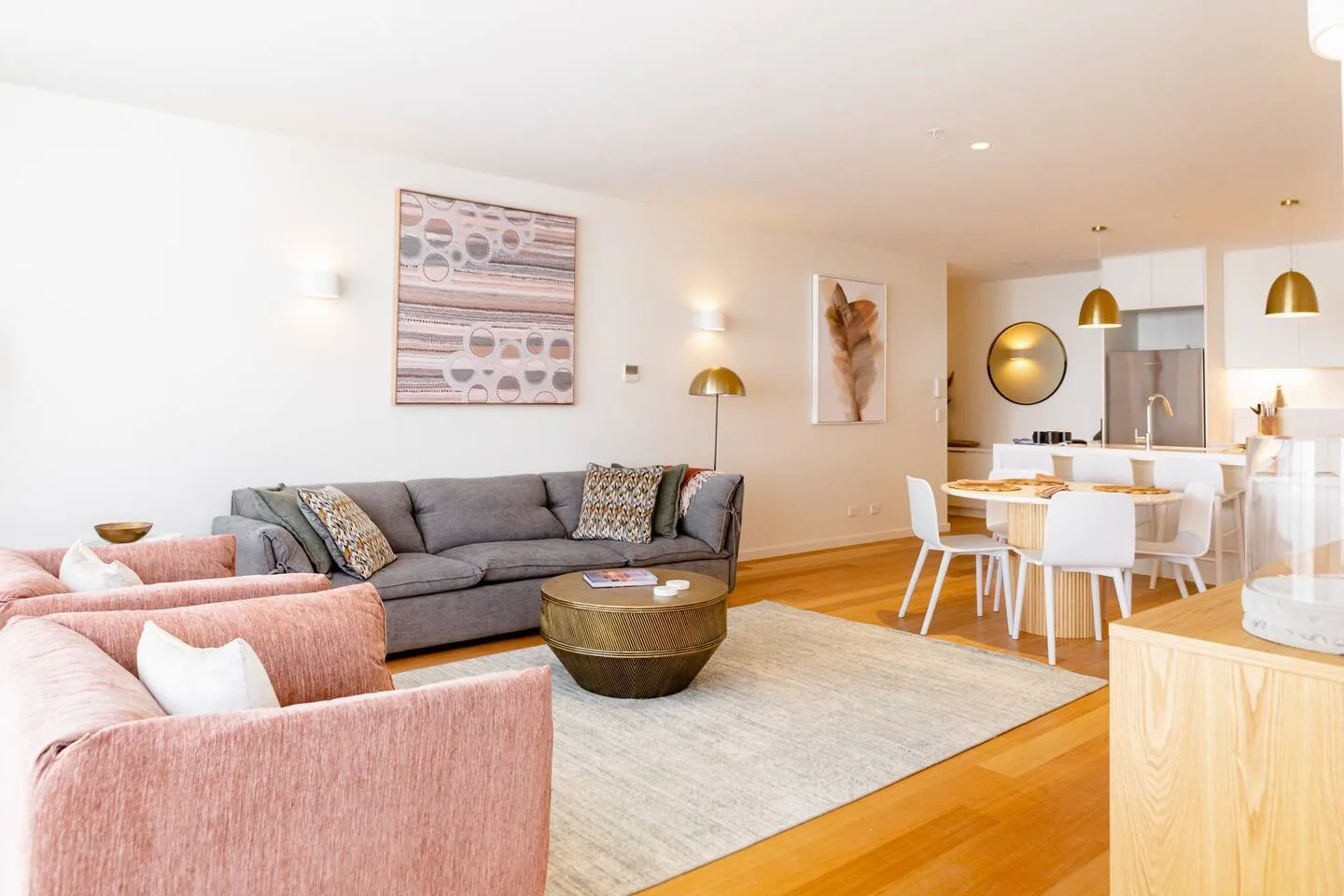 An open-plan living and dining area with seating and a table.