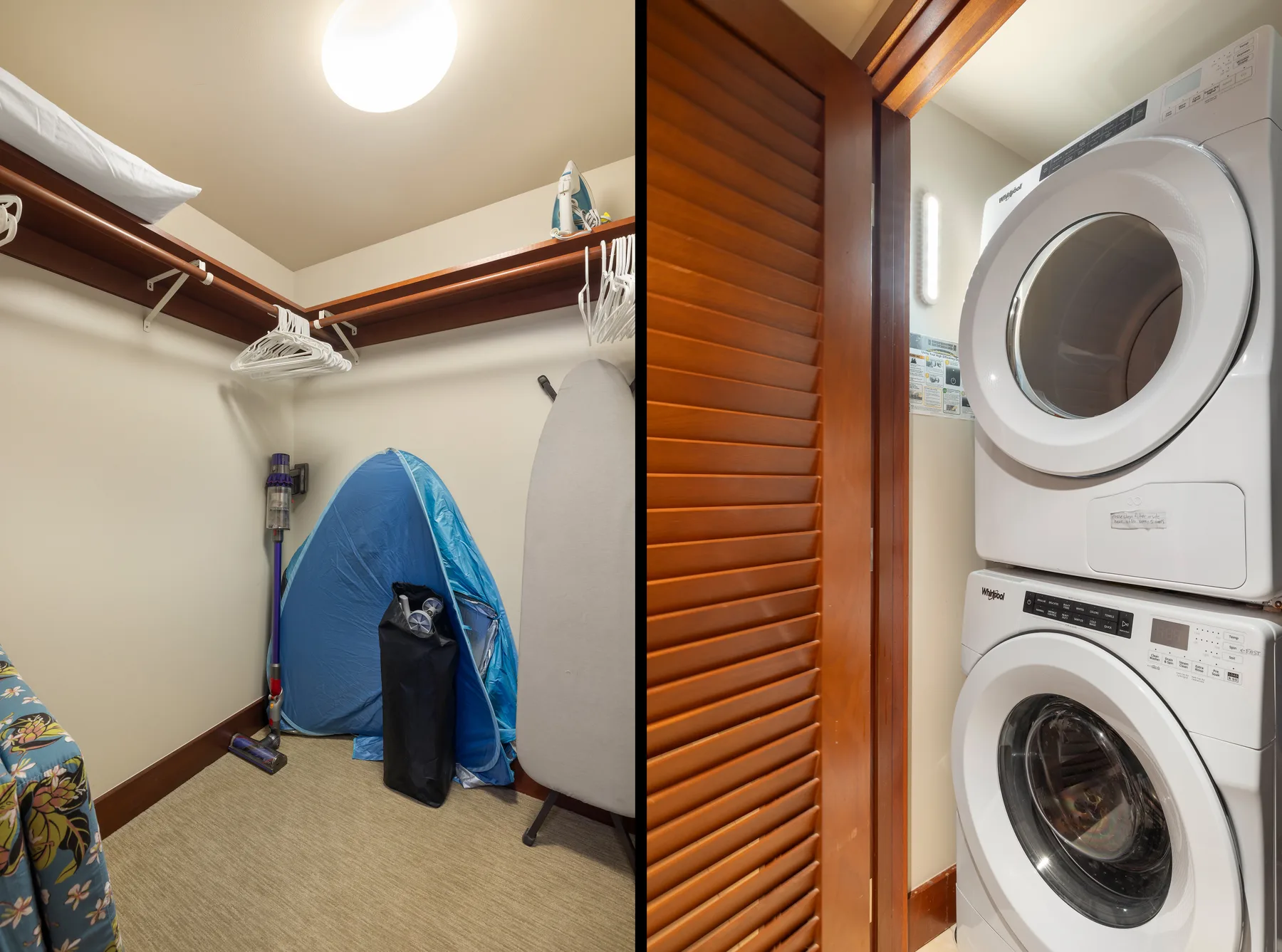 A laundry area with stacked appliances beside a louvered wooden door.