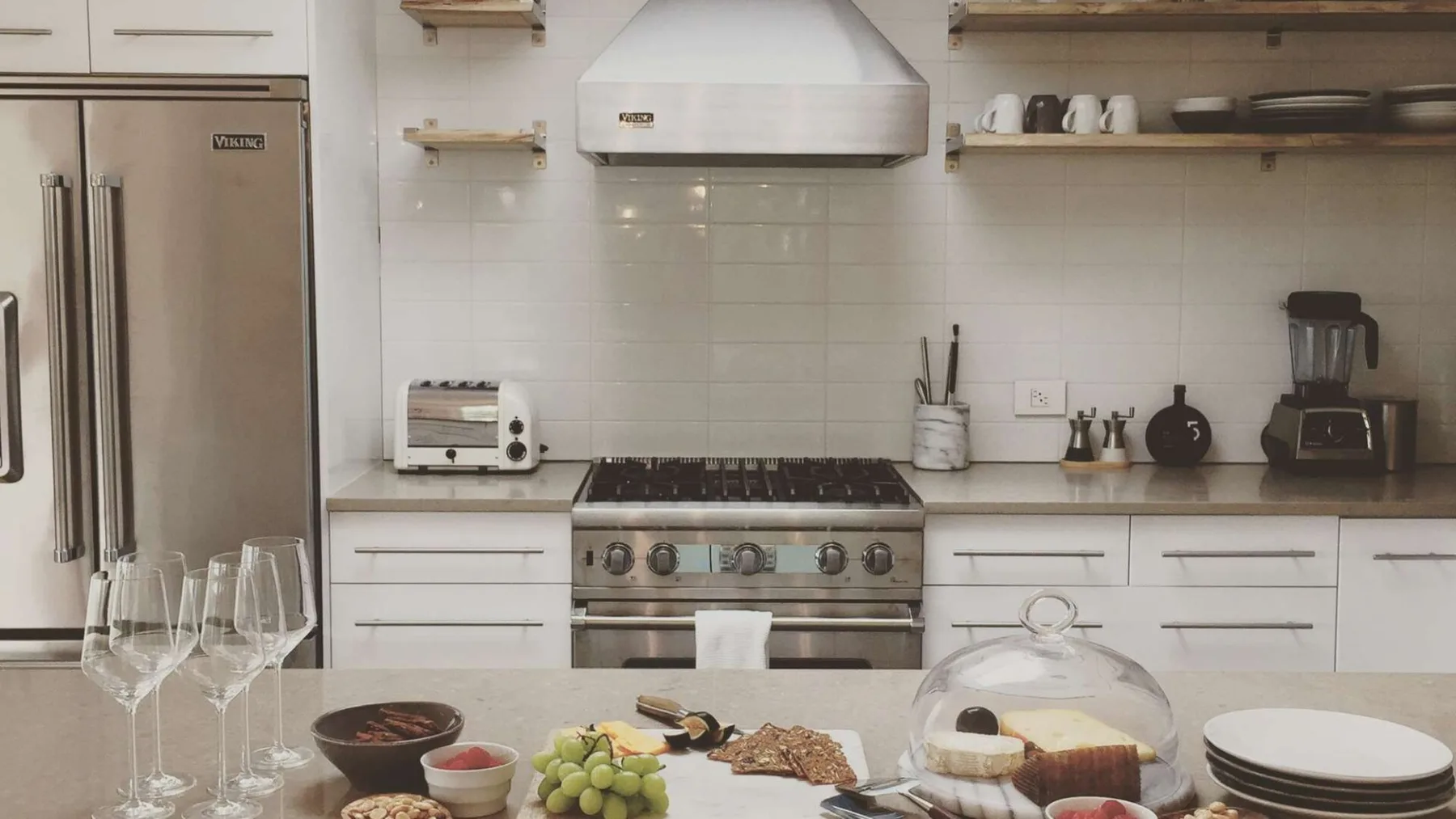 A kitchen with a stove and countertop appliances.
