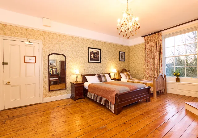 Bedroom with a double bed and a single bed.