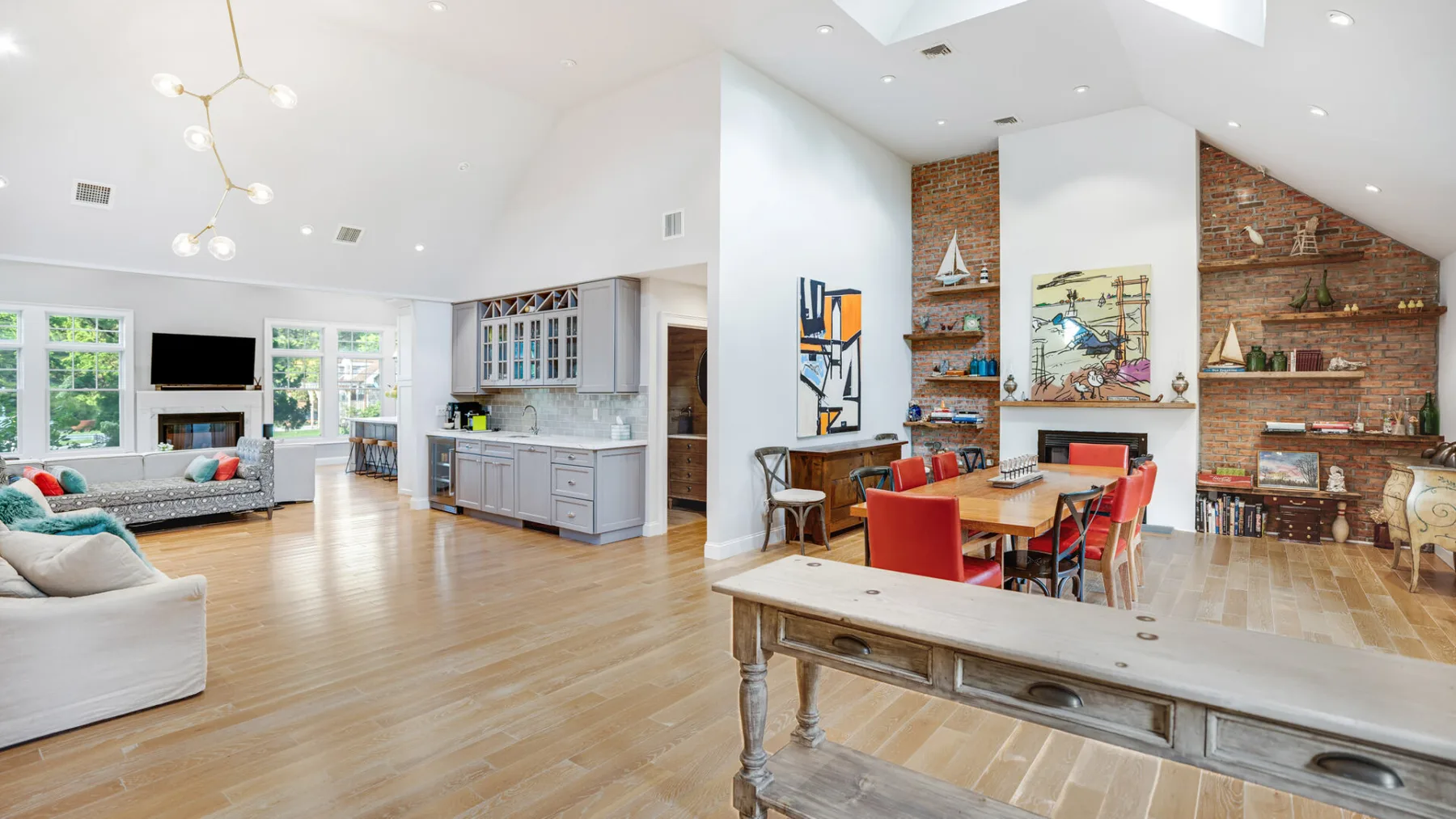 An open-plan living and dining area has a kitchen along the back wall.