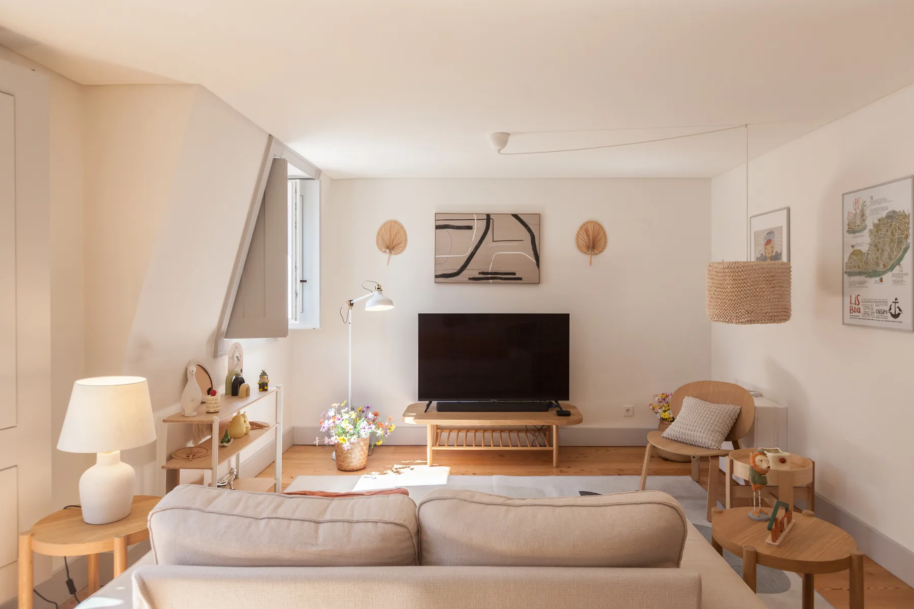 Living room with seating facing a television and a coffee table.