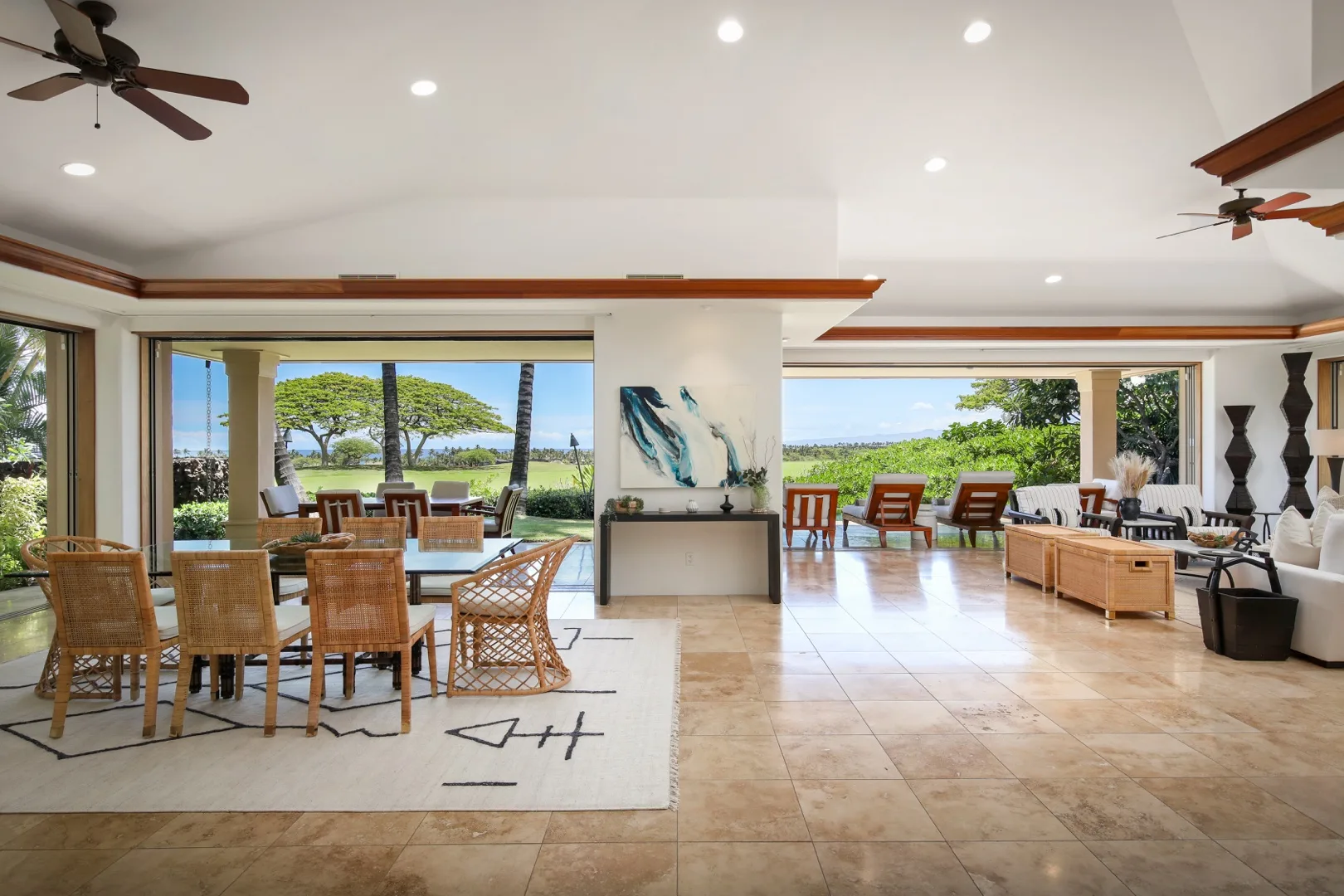 An open-plan living and dining area opens onto a patio with garden views.