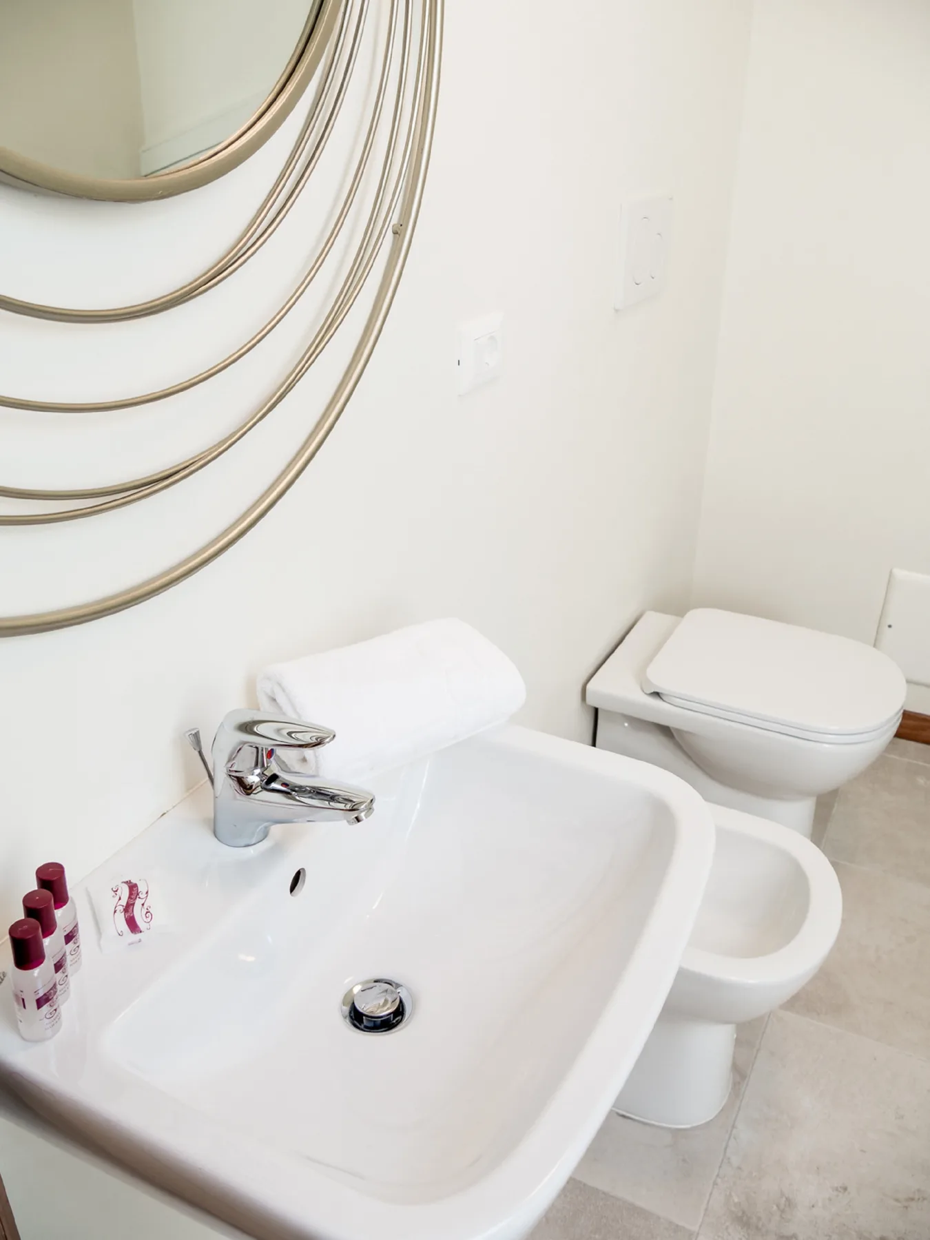 A bathroom with a sink and toilet.