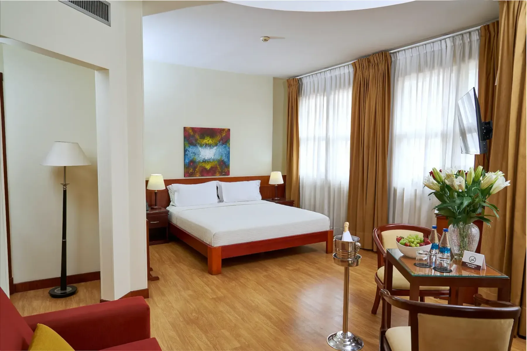 Suite room with a bed and table
