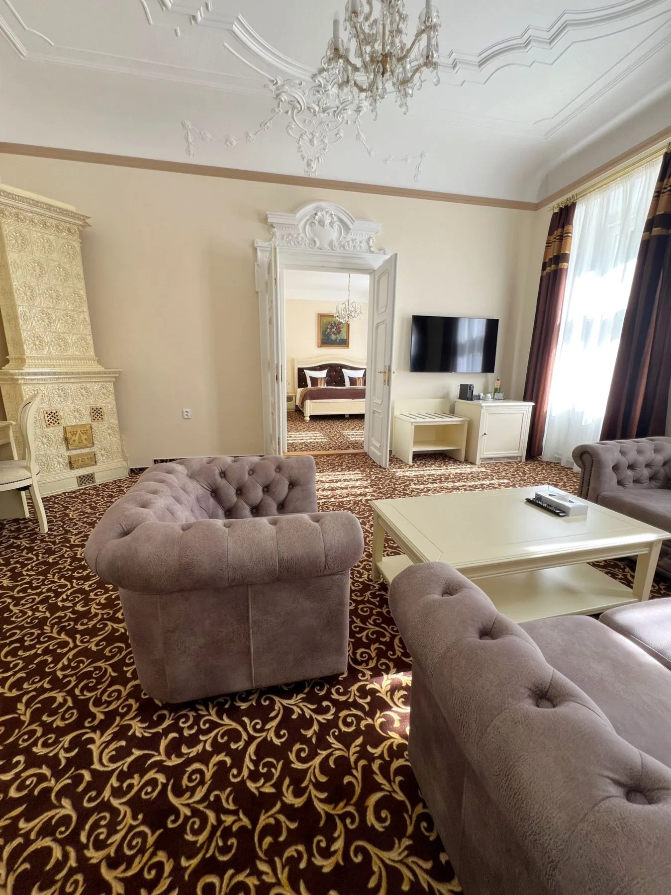 Apartment living room with a view into the bedroom