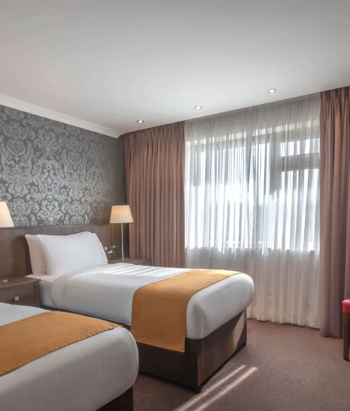 Hotel room with two beds.