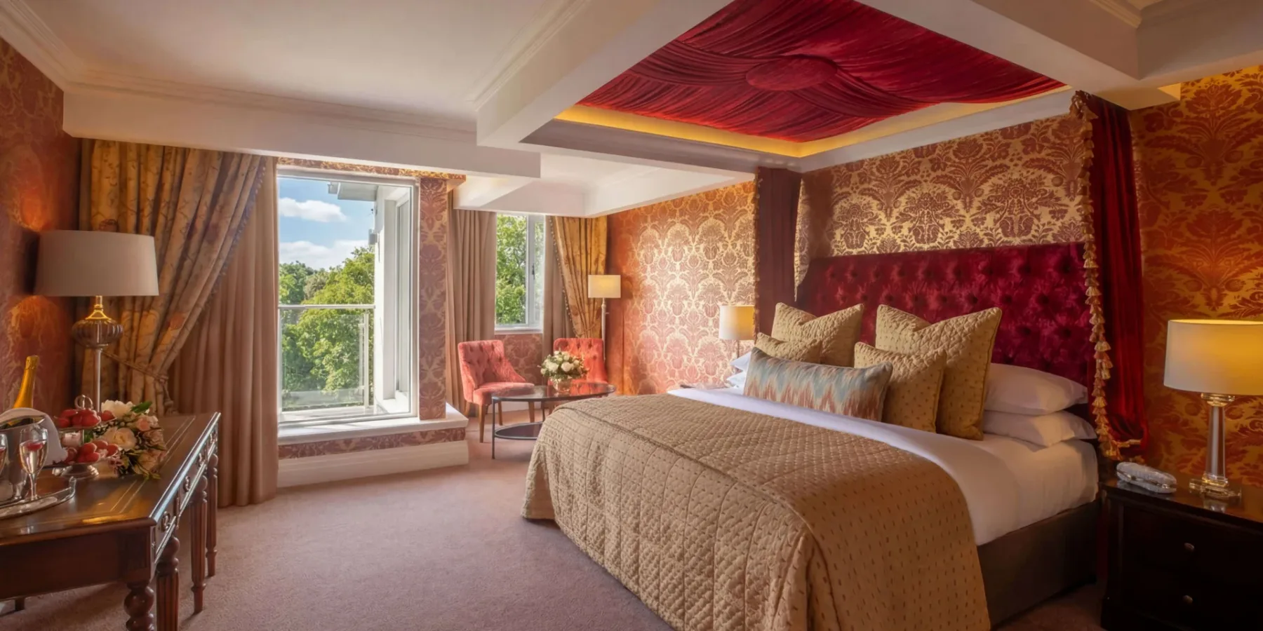 Hotel suite bedroom with king-size bed.