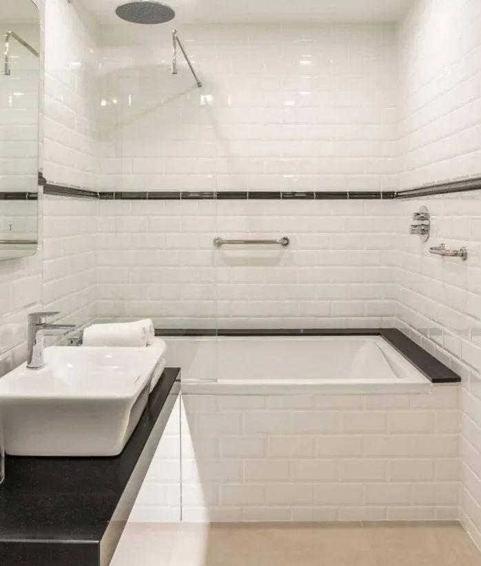 Hotel bathroom with bathtub.