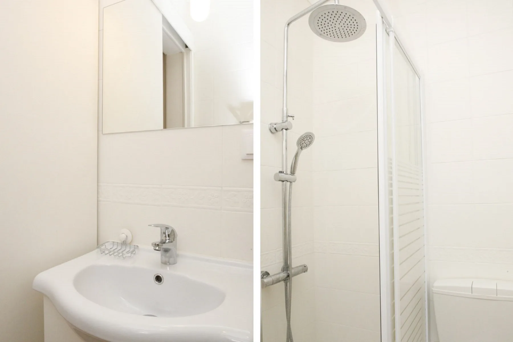 A bathroom with a sink and shower.