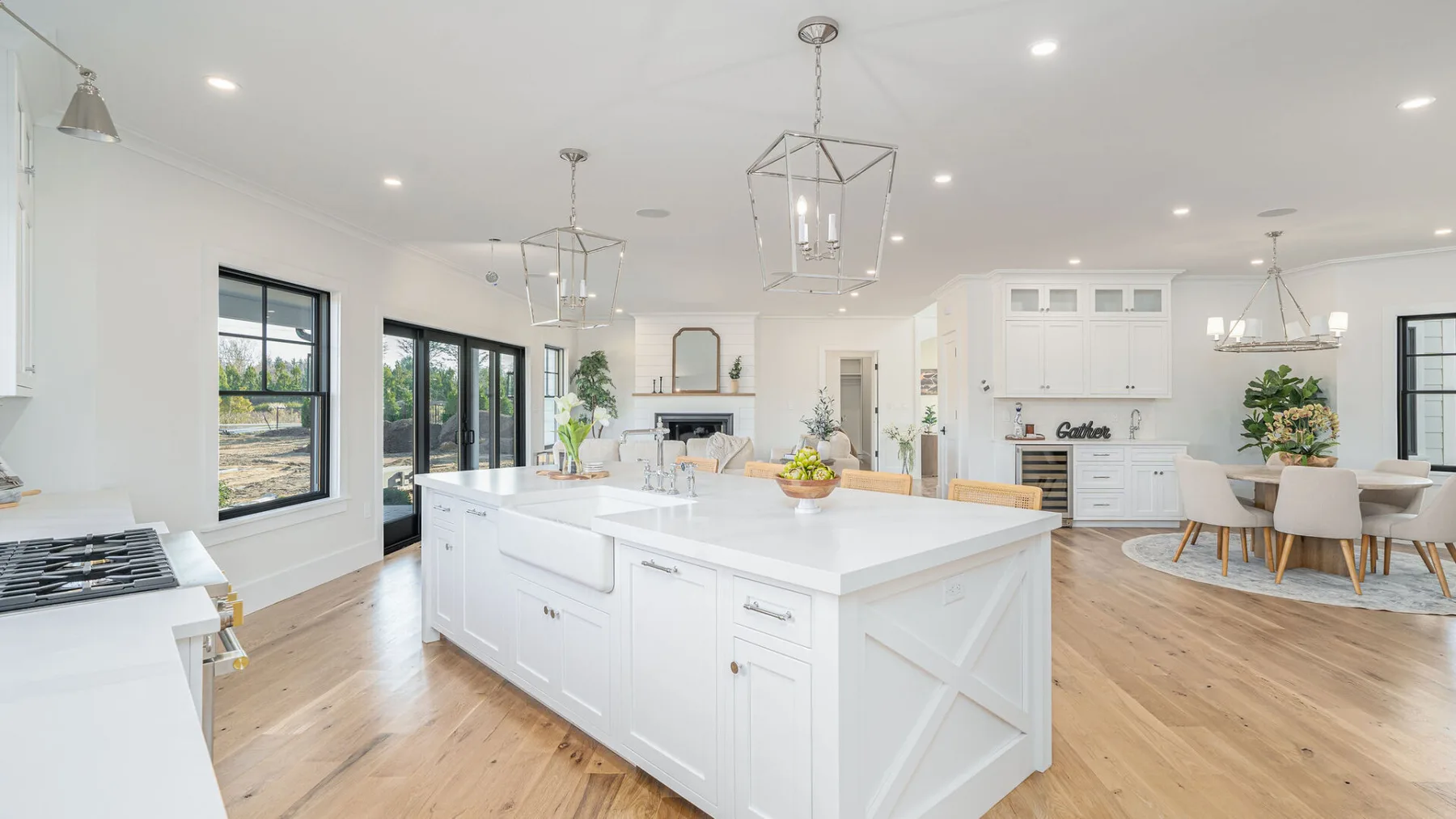 A bright open-plan kitchen and dining area with a large central island.