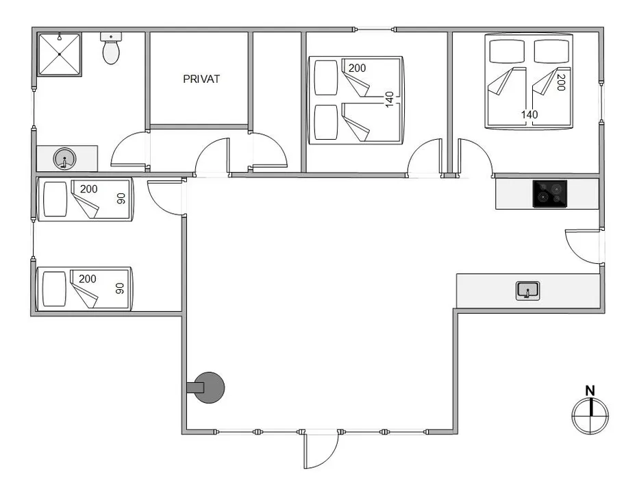 Un plano muestra varias habitaciones distribuidas alrededor de una amplia zona central.
