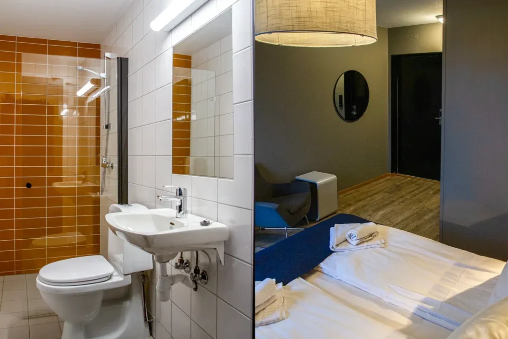 Double room bed and bathroom