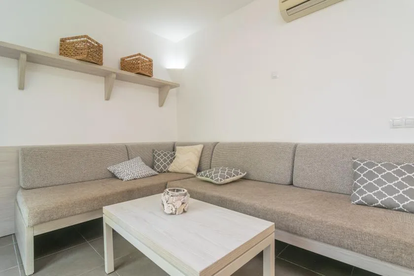 A living room with an L-shaped seating area and a low coffee table.