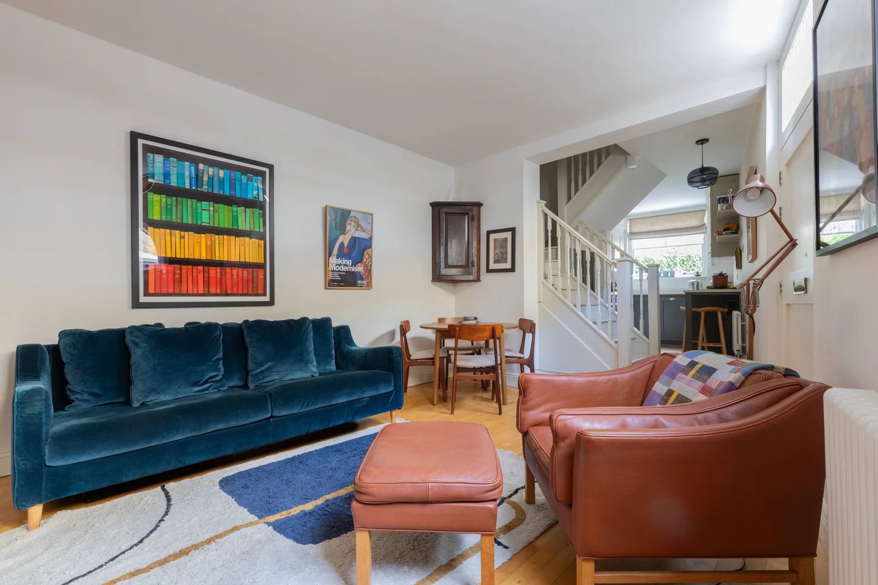 A living room with blue and brown seating around a coffee table.