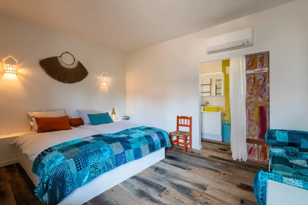 Hotel bedroom with attached bathroom.