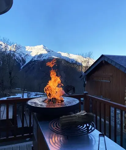 Brasero cooking with mountain views