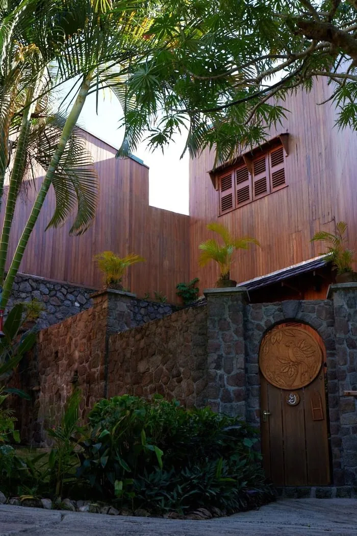 Heritage Suite entrance with a round wooden door and stone walls