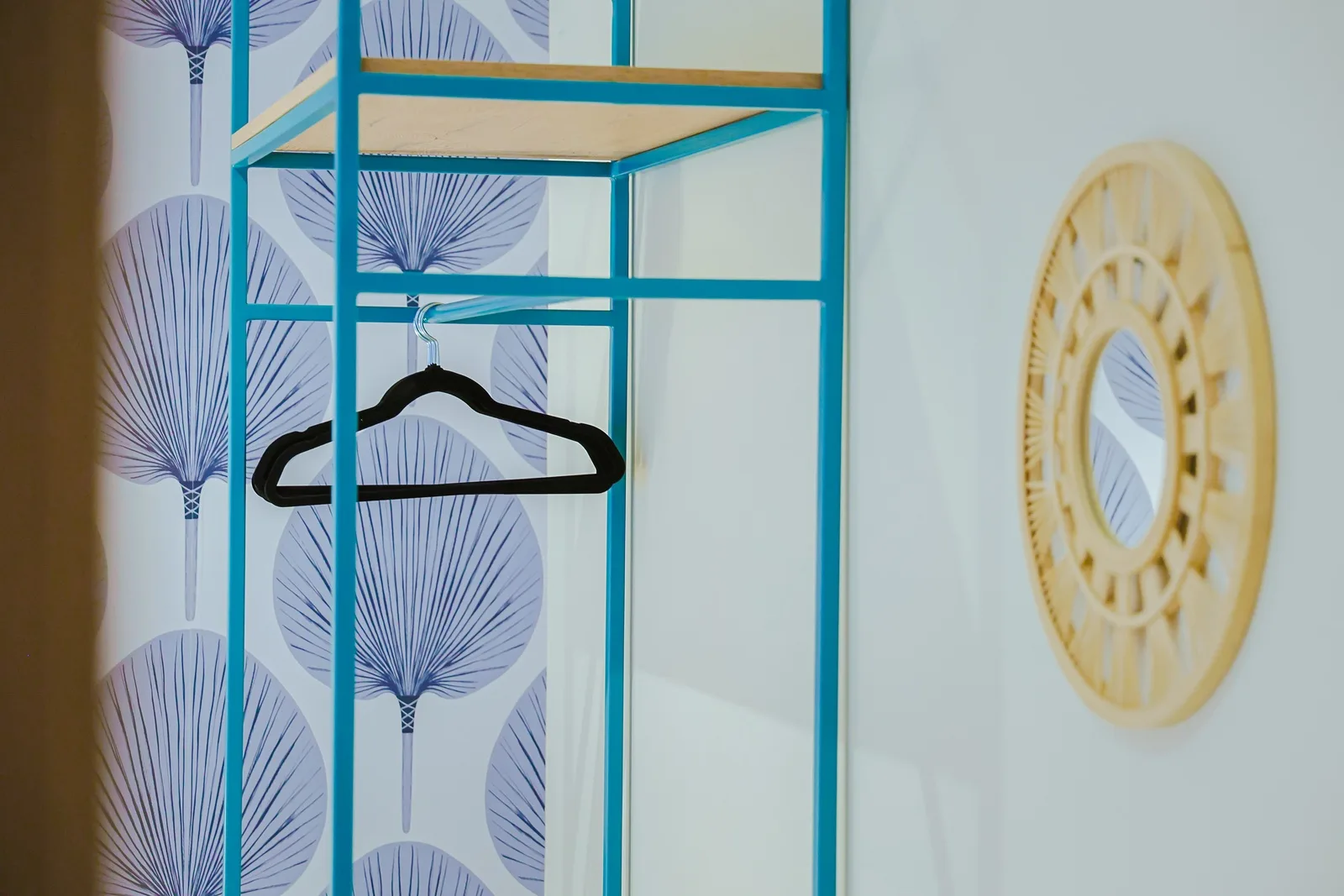 Your wardrobe awaits with tropical-inspired touches and a bright, airy design to keep your belongings organized and accessible.