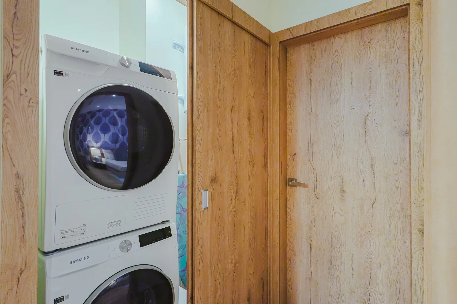 Keep your wardrobe fresh with in-unit laundry machines tucked neatly beside generous storage space.