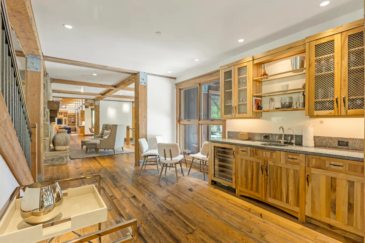 A warm-toned kitchen and dining area opens into a living space.