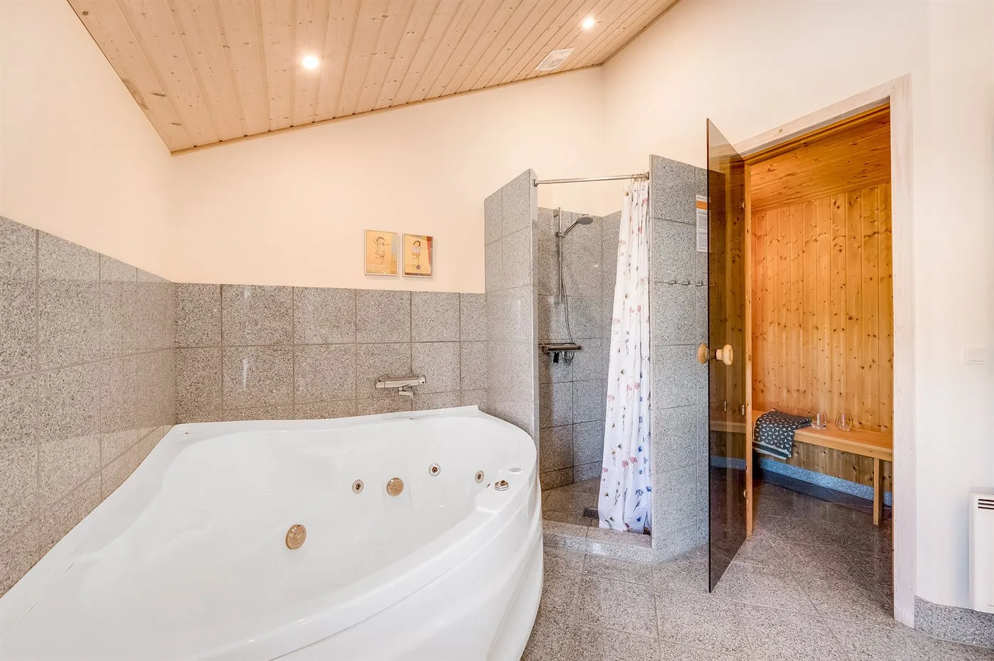 A bathroom with a large whirlpool tub and a separate shower.