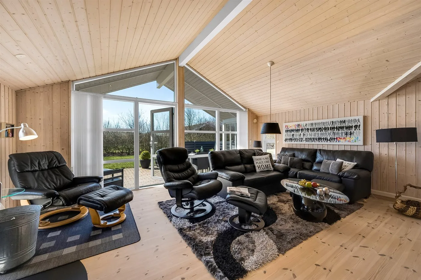 A living room with seating arranged around a coffee table.