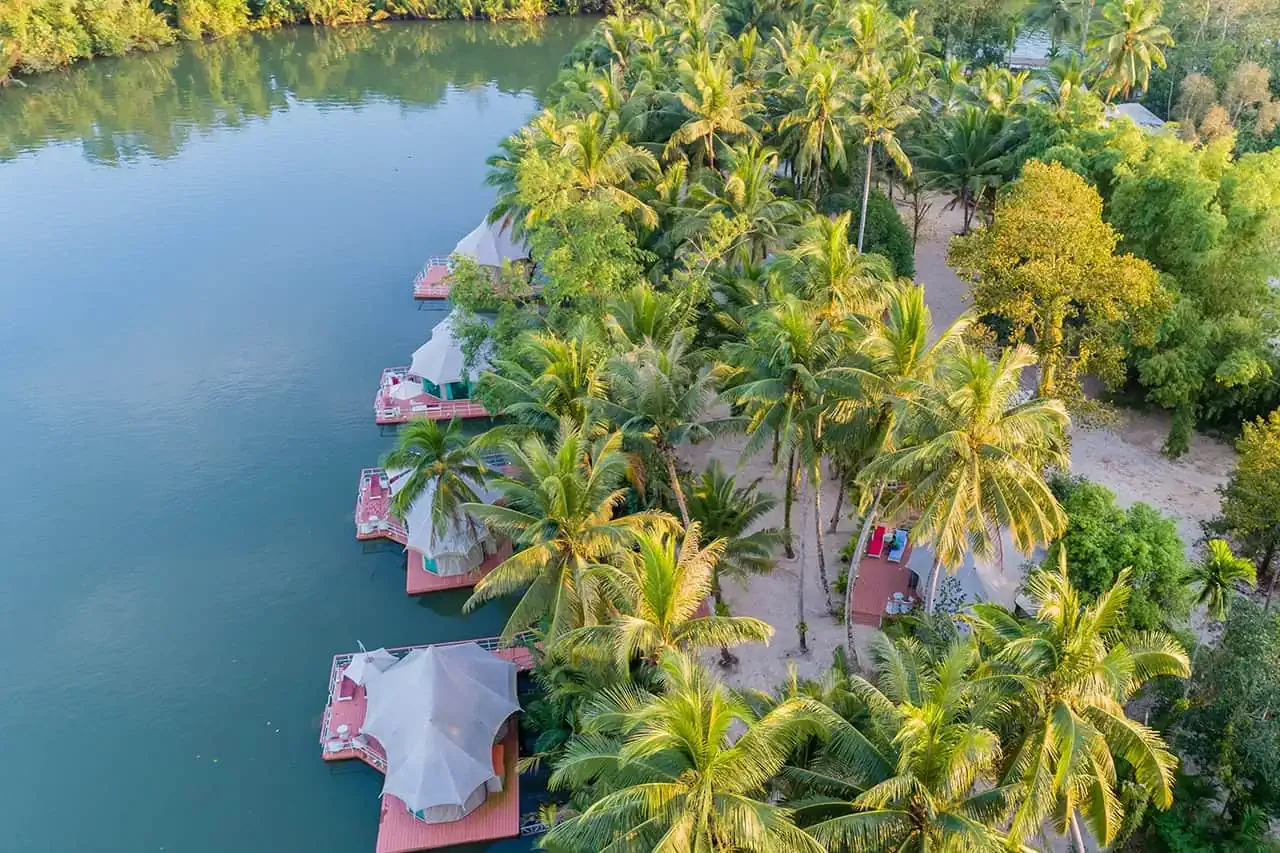Aerial view of the retreat’s tents and river landscape