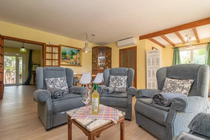 A living room with gray seating arranged around a small coffee table.