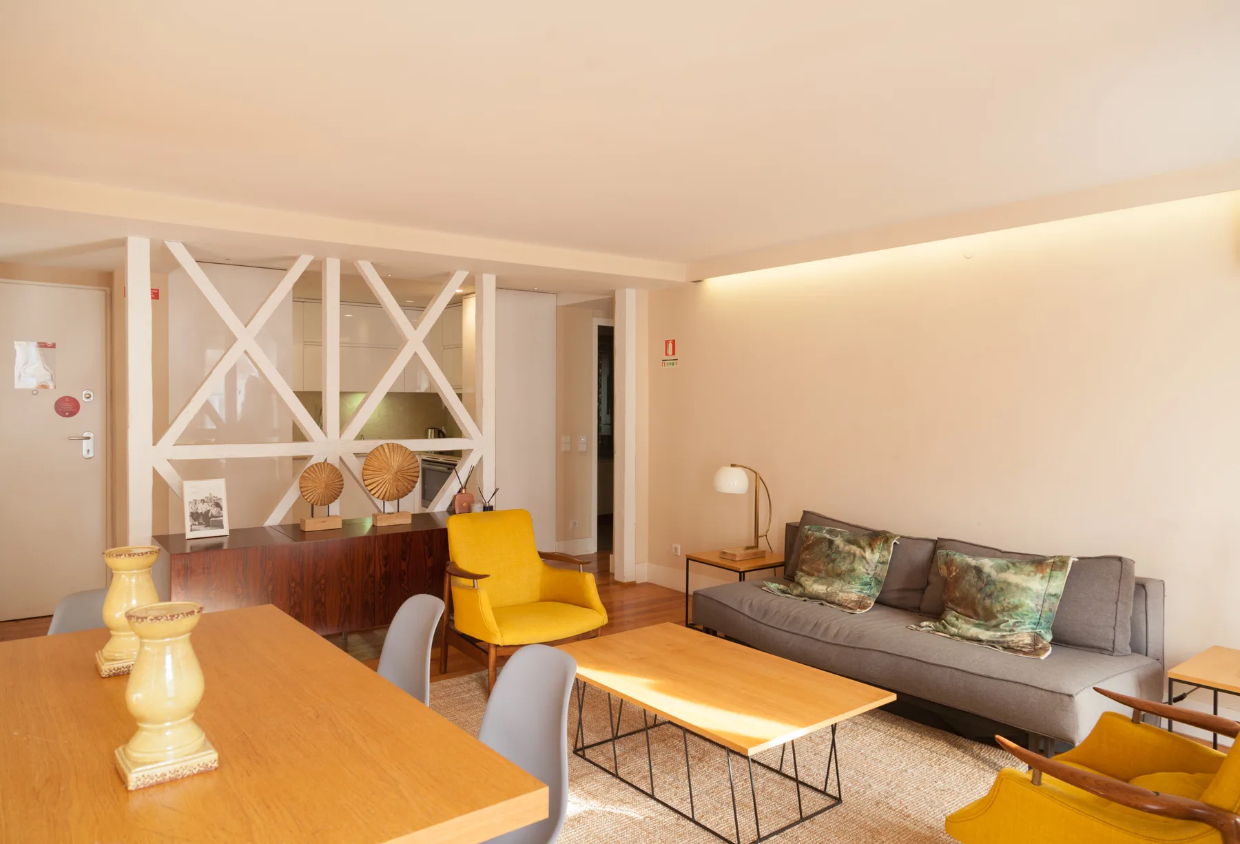 A living room with a gray sofa and a wooden coffee table.