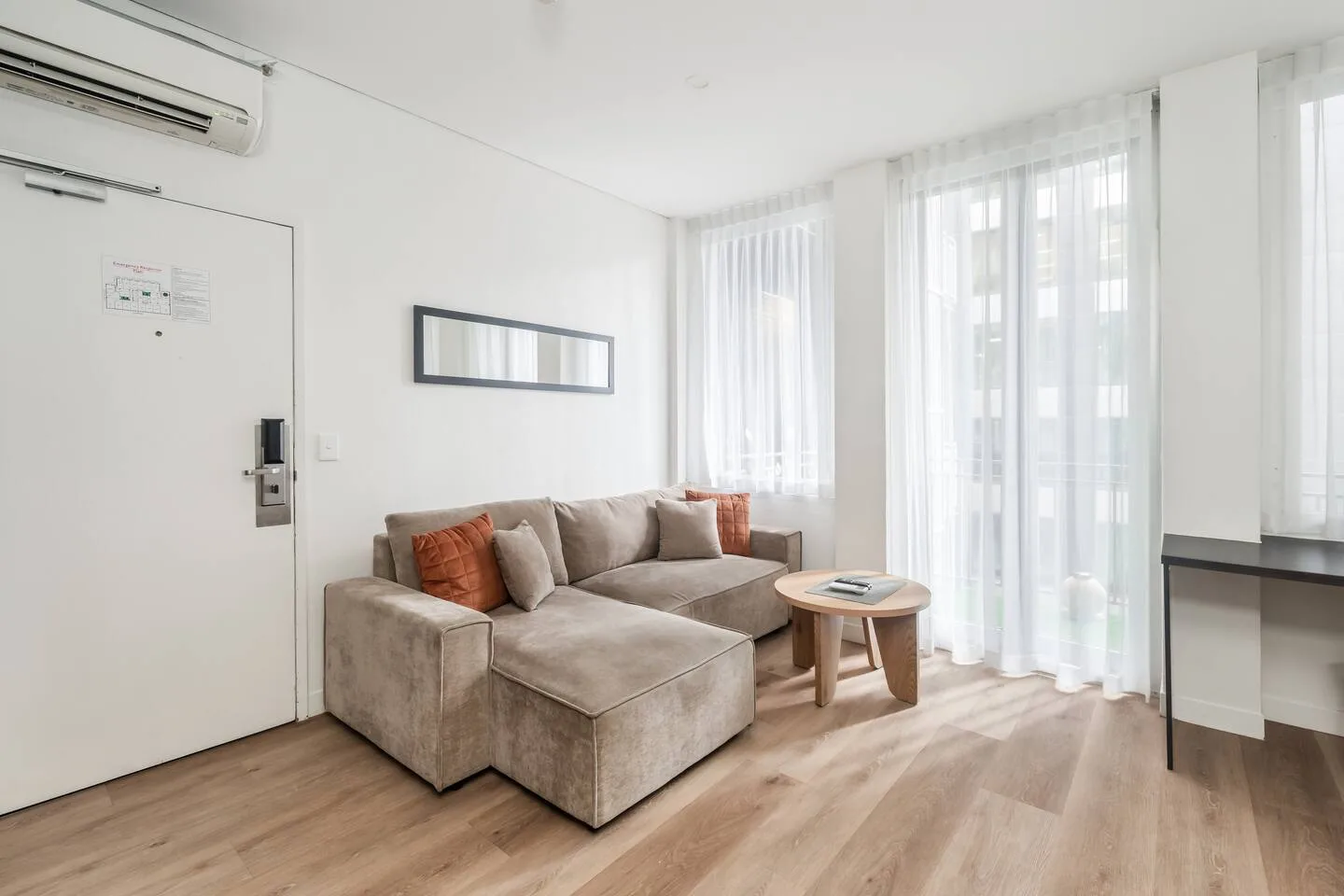 Settle into the living area after a day exploring the city, where plush seating, a TV, and split-system air conditioning and heating create an easy place to unwind in comfort.