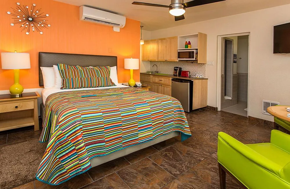 Room interior with bed and kitchenette