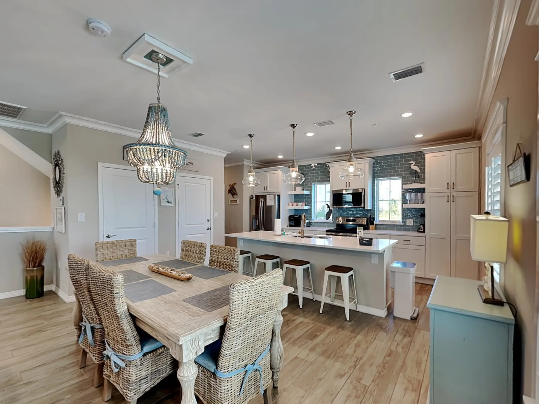 An open dining and kitchen area with a large table and central island.
