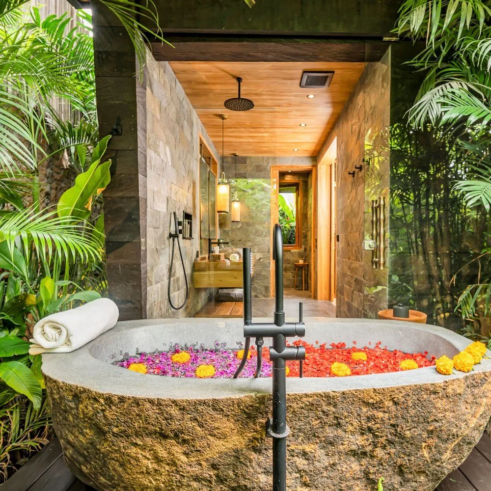 Private plunge pool surrounded by stone walls and garden