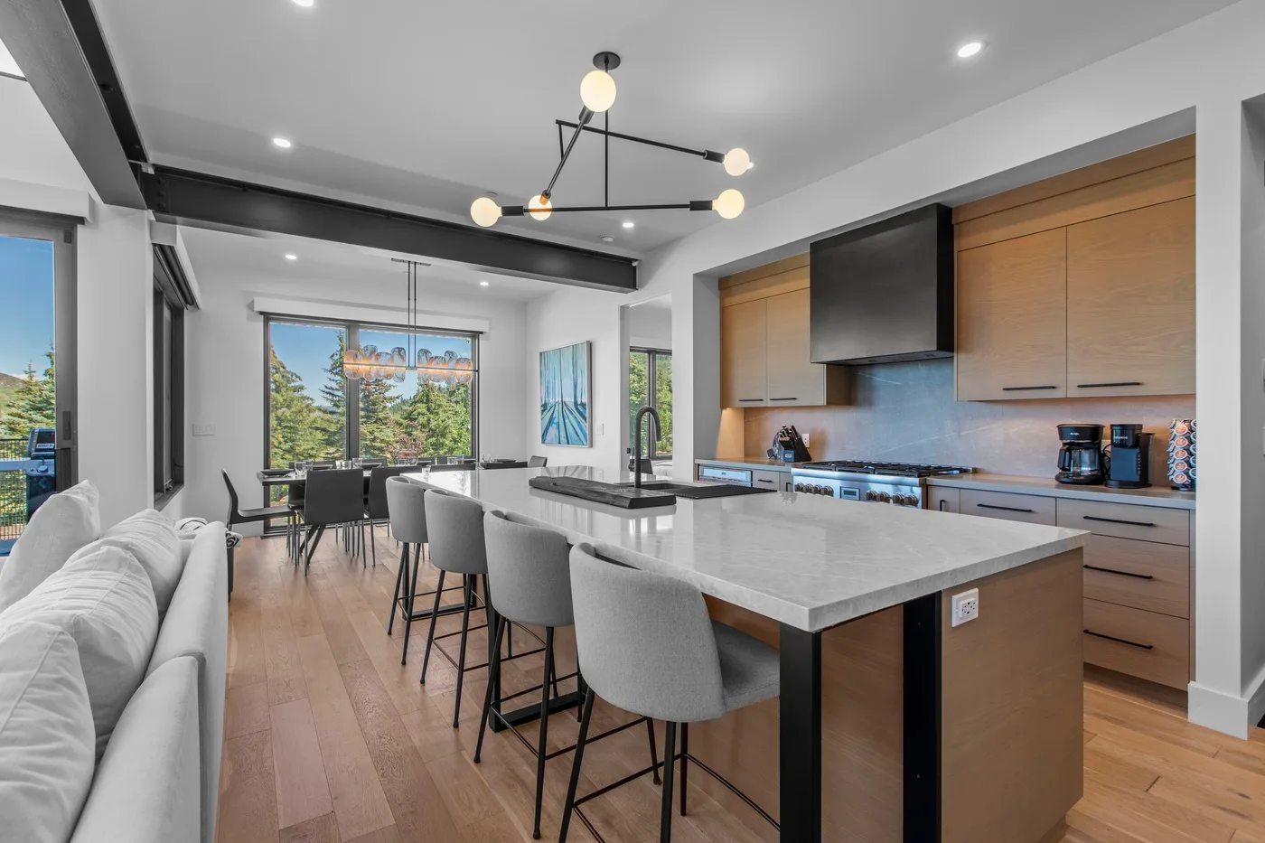 An open-plan kitchen and dining area with a large island and seating.