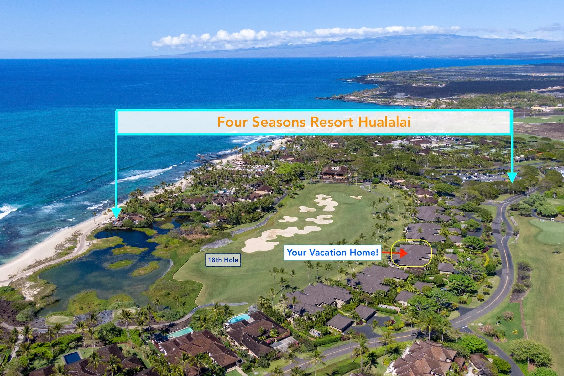Aerial view of a coastal resort with a golf course beside the ocean.