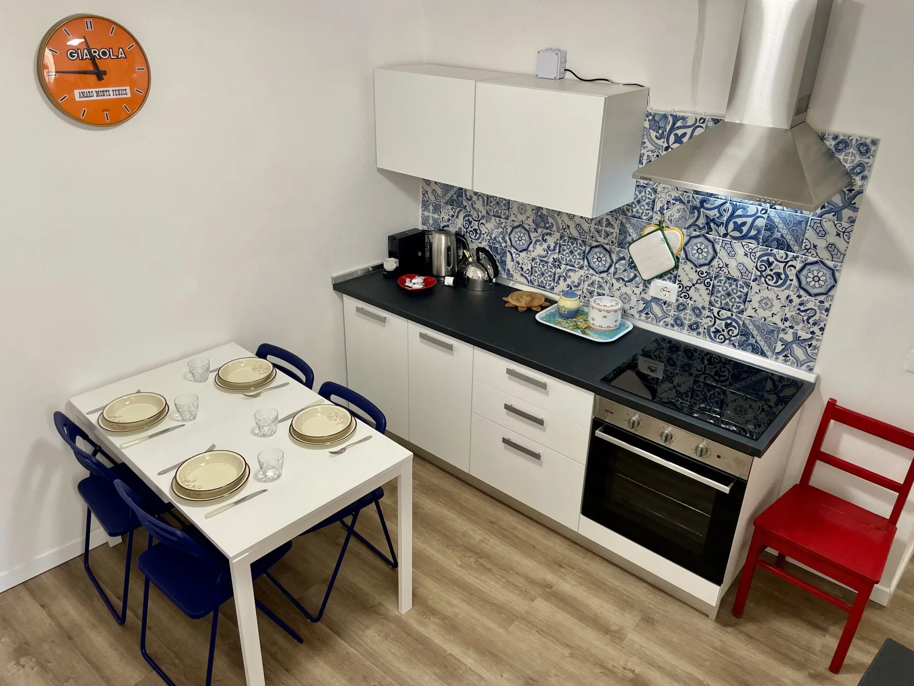 A kitchen with a dining table set beside the counter and stove.
